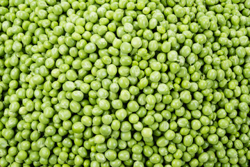 Fresh peas. Green background.