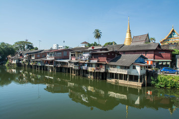 Fototapeta premium village near river in morning with clear blue sky at chantaboon village in chantaburi , Thailand