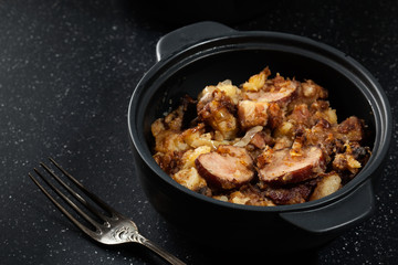 Potatoes baked with sausage and bacon