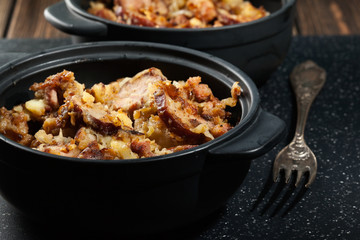 Potatoes baked with sausage and bacon