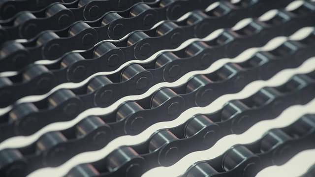 A looping array of infinite bike chains drift across the frame.