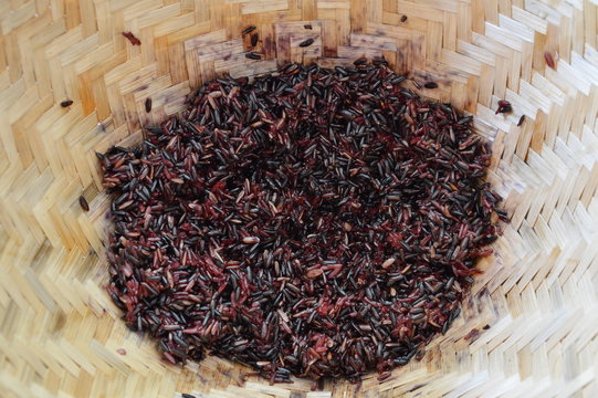 black sticky rice in bamboo earthenware steamer