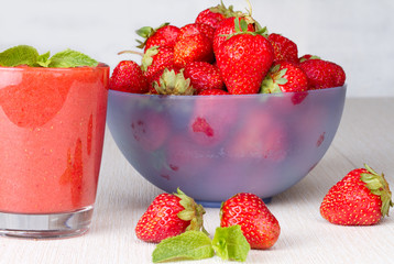 Ripe strawberries and strawberry smoothie