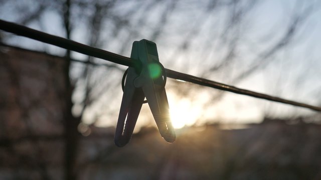 Clothespin on a Background of Sunrice