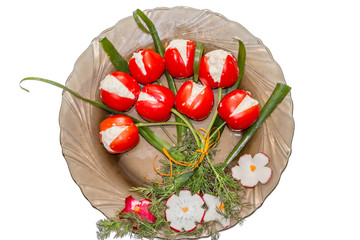 Festive plate with tomatoes filled with cheese, looking like tulips