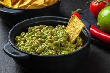 Bowl of guacamole with corn chips