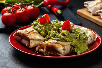Mexican chimichanga with guacamole dip