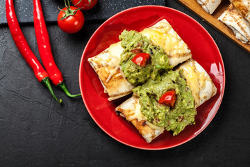 Mexican chimichanga with guacamole dip