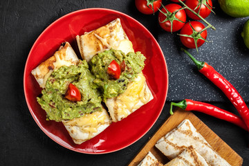 Mexican chimichanga with guacamole dip