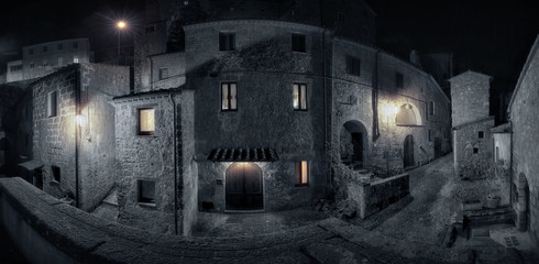 Medieval town street at rainy night