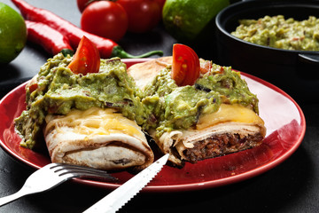 Mexican chimichanga with guacamole dip