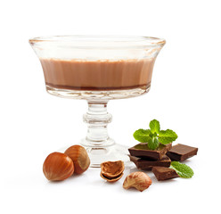 Chocolate mousse dessert with mint and hazelnuts