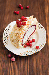 Dessert roll with delicious cream and red currant
