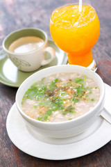 Boiled rice pork or mush with orange juice and hot coffee. Thai Food.