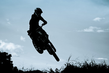 motocross action with sunset background
