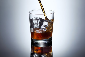 Glass of whiskey with splash