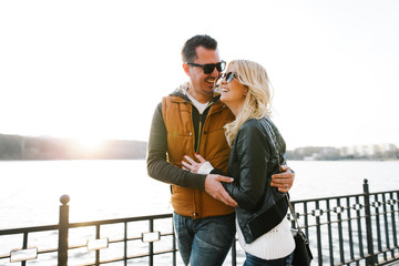 Happy In love couple smiling and hugging eachother outdoor 