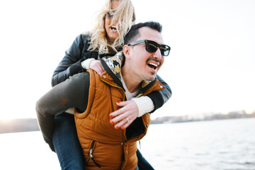 Happy In love couple smiling and hugging eachother outdoor 