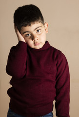 Studio shot of Iraqi boy wearing red  T-shirt
