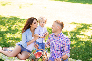 Happy family relaxing on a picnic