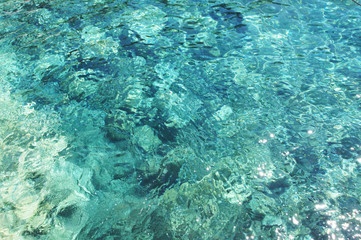 Azure clear Mediterranean sea on Santorini island.