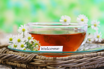 Welcome card with cup of chamomile tea
