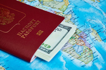 Passport and money on a topographic map