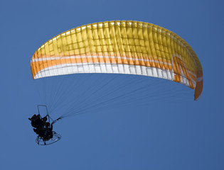 Paragliding in tandem with propelling on sky background