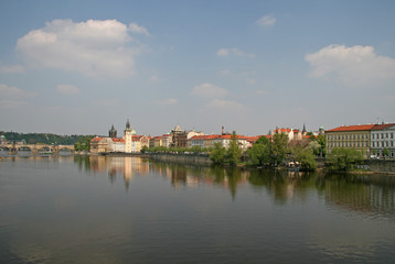 PRAGUE, CZECH REPUBLIC - APRIL 28, 2010: Vltava river with Charles bridge crossing the river, museum of Bedrich Smetana and Old Town Water Tower in the background