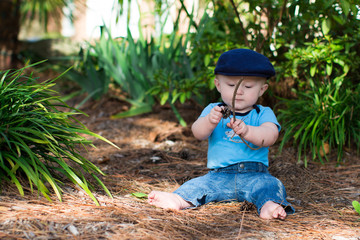 Baby Boy Playing With Sticks