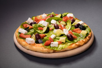 Pizza Vesuvio with mozzarella, tomato sauce, ham, olives... serve