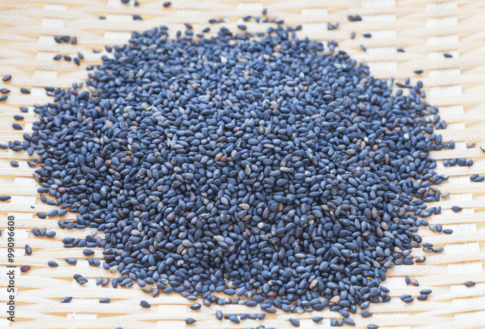 Wall mural black dry sesame seed , a common ingredient in cuisine