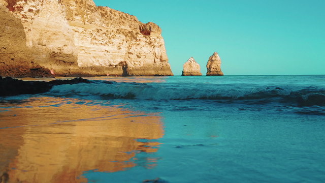 Inspirational low angle shot of an isolated beach in the Algarve, Portugal.

