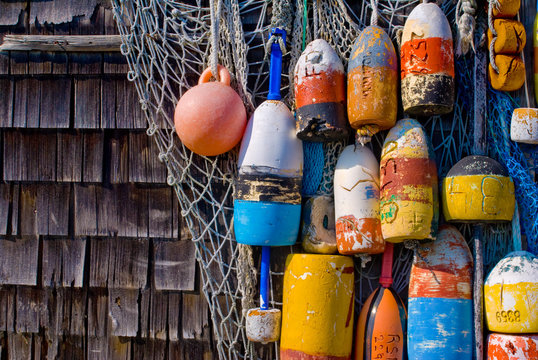 Colorful fishing buoys hanging on the wall