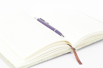 Notebook with pen isolated on white background