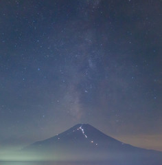 Fototapeta na wymiar Summer night landscape of Mountain Fuji with milky way