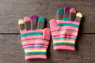 gloves for baby on old wooden