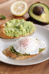 poached eggs with avocado salad .