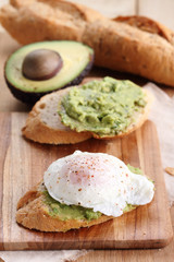 poached eggs with avocado salad .