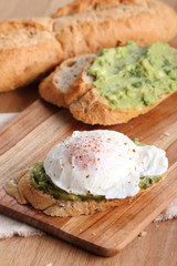 poached eggs with avocado salad .