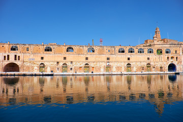 Fototapeta premium The old dock building at Bormla (Cospicua) waterfront. Malta.