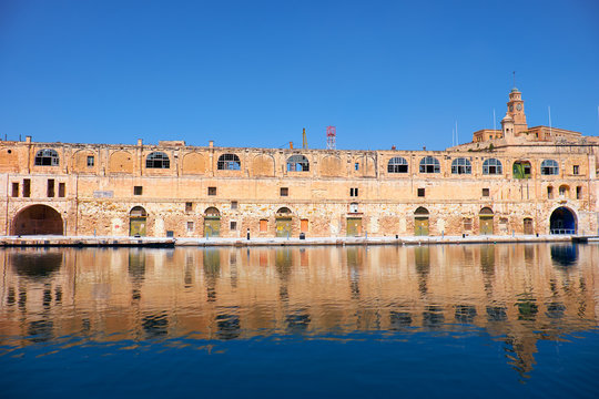 The old dock building at Bormla (Cospicua) waterfront. Malta.