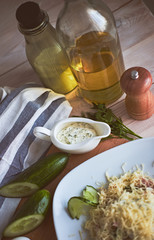 Ingredients for salad. Cucumber, egg, cheese, ham, gravy, towels