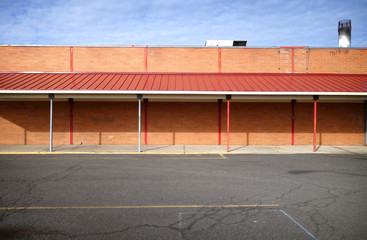 worn vintage old building and parking lot © jdoms