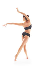 Young beautiful ballet dancer posing on a studio © matyuschenko