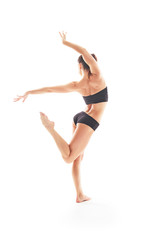Young beautiful ballet dancer posing on a studio © matyuschenko