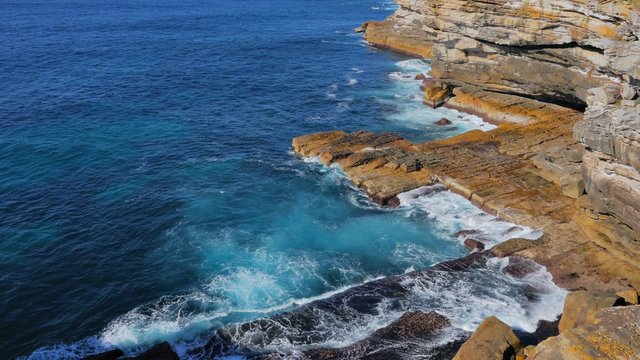 Ocean waves crashing against cliff, The Gap Lookout, South Head, Sydney