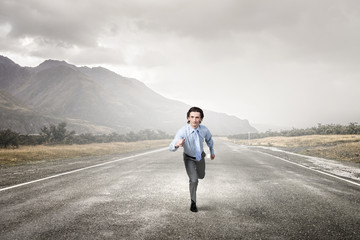 Businessman run on road