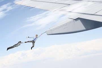 On wing of flying airplane