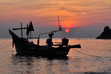 Fishing boat with sunset